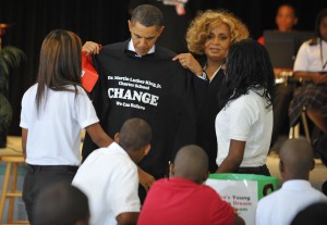 President Obama receives a t-shirt from New Orleans charter students. Madel Ngan/AFP/Getty Images