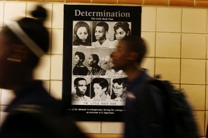 NYC charter students pass a poster of the Little Rock Nine, recalling the events that led to public school desegregation. Photo by Emily Berl.