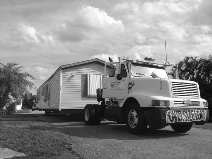 Eddie (a licensed mobile home mover): “The builders figured out that they can buy these parks and get rid of the people cheaper than they can actually go and buy the land and pull buildings down and stuff. So I got in with the builders; I've actually been closing these parks for almost 25 years ... They’d call me and they’d say, ‘Listen, we are going to go close this park,’ two or three months before anybody would know. And I would go stake out these parks, and I would just ride around quietly and I would check everything out and see what was going on, and I would give them an idea of what was going to cost. And then we'd set up a deal ... I have the contract, the builder is getting the thing emptied. Everybody is happy!” © Esther Sullivan