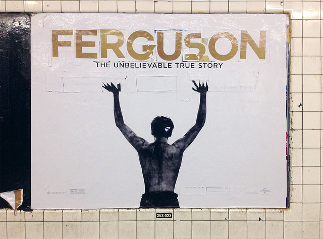 An artist's remix of an "Unbroken" movie poster shows how far the "Hands Up, Don't Shoot" message from Ferguson spread. Image by PosterBoy via flickr.com.