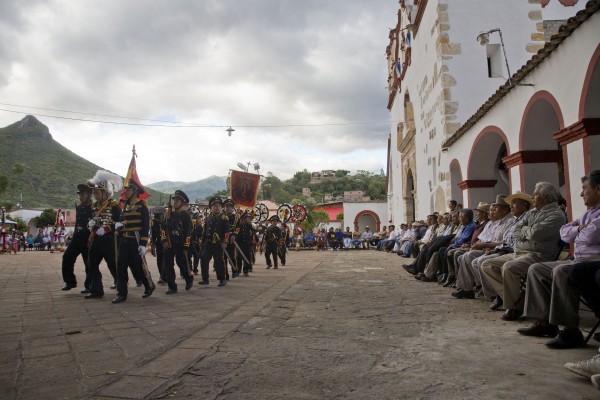 Children representing the soldiers of Cortes march in front of the community authorities. To form alliances against the Aztecs, Cortes needed a translator. First he found a priest who could speak Mayan, then a Nahuatl woman from the Gulf Coast who could translate between Mayan and Nahuatl, the language of the Aztecs and surrounding peoples. Malinalli, or Doña Marina, was one of 20 women given to the Spaniards by the residents of Tabasco. She became Cortes' lover and advisor, and bore Cortes’ first son, Martin.