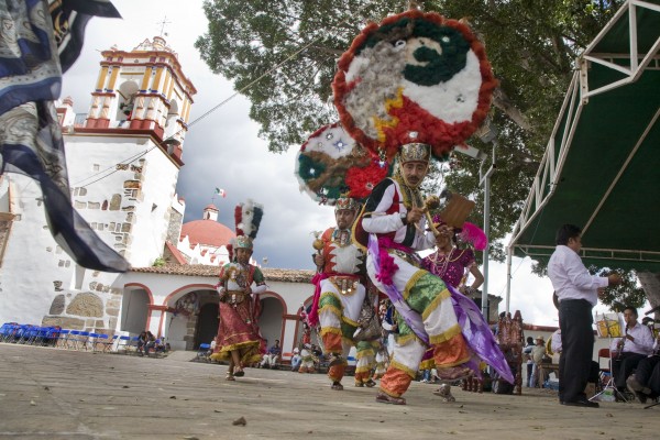 The dance of Malinche. Malinalli became known as the Malinche, an object of hatred and veneration ever since. She is blamed for the defeat of the feathered warriors of Tenochtitlan and the end of purely indigenous civilization in Mexico. But she was also the mother of one of the first children borne of this enormous clash. The Oaxacan Jose Vasconcellos, secretary of education in Mexico's first post-Revolutionary government, called the mix a new race: la raza cosmica or “the cosmic race.” He and his intellectual companions held that Mexico had people of mixed indigenous, African, and European ancestry, and was therefore moving beyond the boundaries of the old world. While the union of Malinalli and Cortes gave birth to the mestizo, this did not free indigenous people, who were forced into conditions close to slavery. When Cortes died, Martin became Marquis of the Valley of Oaxaca. His lands included 23,000 people living in 11,500 square kilometers of territory. The Spaniards set up the encomienda system, huge land grants that included the indigenous population, forced into slavery to “pay” for room, board, and religious instruction.