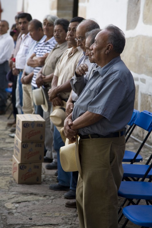 The community's authorities preside over the dance. “Why do people make the commitment?” Hernandez asks. “These commitments have a religious and spiritual importance. [Benito Mendoza Mendoza, who played Moctezuma in 1977, said] 'In some cases we do it because the Lord helped us overcome our food situation, when we had no money. Others do it because of their faith. And other people do it because they had a personal problem, or were sick and got better. Therefore, to give thanks to God that they were able to move forward they made the commitment. There are many reasons why people do it.'” The Dance of the Feather in Teotitlan has had its ups and downs, according to Hernandez. “There have been long periods in which it wasn't performed, until someone takes the initiative to revive it. In different historical periods various situations have caused a break in the tradition. Modern social forces have played a paradoxical role, sometimes leading to changes in the dance. But at the same time, they've allowed it to survive, to be reproduced and to continue to exist.”