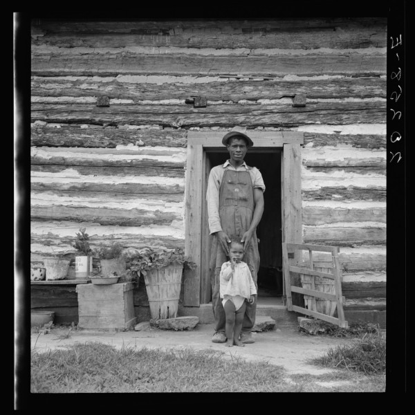 Young sharecropper and his first child. Hillside Farm. Person County, North Carolina.