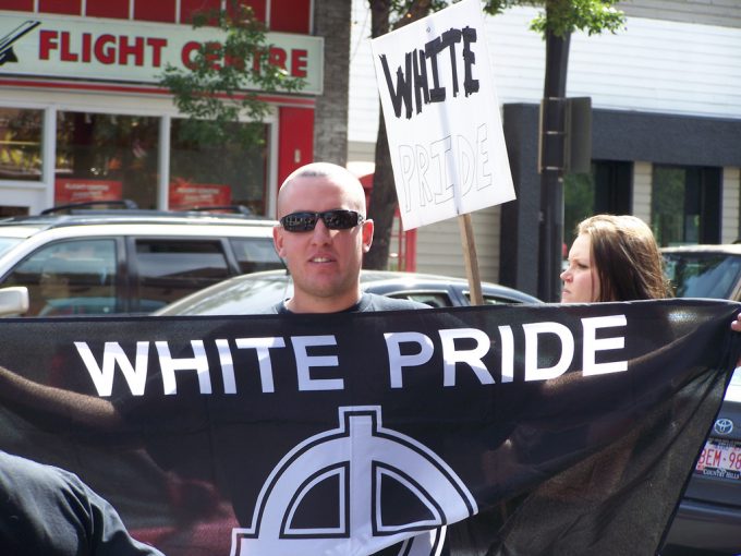 An "Aryan Guard" member protesting at an anti-racist rally in Alberta, Canada, 2007. Robert Thivierge / FlickrCC