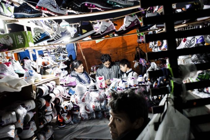 Running a sweatshop and market stall is commonly a family affair. Many immigrants—mostly Bolivian—arrive in Buenos Aires to work for a relative. Some have their passports confiscated until they can pay off the cost of their passage.